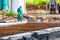 Construction worker performs the construction of the factory shed