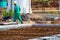 Construction worker performs the construction of the factory shed