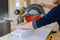 Construction worker remodeling home Carpenter cutting wooden trim board on with circular saw