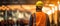 Construction Worker with Safety Helmet and Orange Vest in a Construction Zone