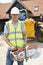 Construction Worker On Site Holding Circular Saw