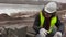 Construction worker sorting pavement close up