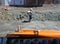 Construction worker spray water on cement