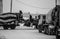 Construction worker stands on a concrete mixer on a black and white photo