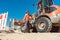 Construction worker starting road works on site