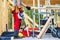 Construction Worker Staying Next to Wooden Skeleton Frame of a House