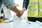 Construction worker team contractor handshake after finishing business meeting to start up project contract in construction site b