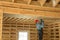 Construction worker thermally insulating eco wooden frame house