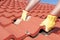 Construction worker tile roofing repairs