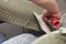 Construction worker is tiling at home tile floor adhesive