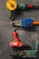 Construction worker tools on dark background top view