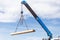 Construction worker unloading concrete stake from truck