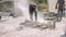 The construction worker use electric concrete cutter cut a stone