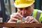 Construction worker using colourful toy bricks