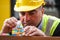 Construction worker using colourful toy bricks