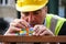 Construction worker using colourful toy bricks