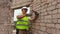 Construction worker using hammer and chisel