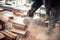 Construction worker using a professional angle grinder for cutting bricks and building interior walls