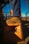 Construction worker wearing heavy duty steel cap boot using safety step white working at height