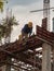 Construction Worker Welding soldering metal girders and Sparks