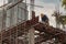 Construction Worker Welding soldering metal girders and Sparks