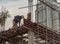 Construction Worker Welding soldering metal girders and Sparks