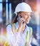 Construction worker, woman with smartphone for phone call and communication with technology and helmet for safety. Happy