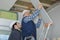 Construction workers adjusting ceiling panels