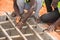 Construction workers busy with construction of septic pit