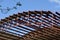 Construction workers doing roof job of a covered gym court