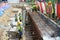 Construction workers fabricate retaining wall reinforcement bar and formwork at the construction site.
