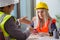 Construction workers having discussion in office before starting