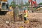 Construction workers install bore pile reinforcement bars