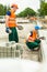 Construction workers installing paving stones