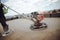 Construction workers leveling sand and cement screed over roof terrace concrete