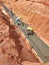 Construction workers are levelling a layer of lean concrete in the trenches at the construction site.