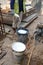 Construction workers mixing and spraying the anti termite chemical treatment to the soil at the construction site.