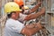 Construction workers positioning formwork frames