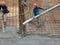 Construction workers pour wet concrete using a hose from the elephant crane or concrete pump crane at the construction site.