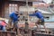 Construction workers pouring cement to creating beam to build a