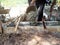 Construction workers pouring concrete in building site