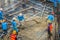 Construction workers are pouring concrete in post-tension flooring work. Mason workers carrying hose from concrete pump or also k