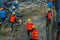 Construction workers are pouring concrete in post-tension flooring work. Mason workers carrying hose from concrete pump or also k