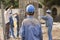 Construction Workers Putting Cylindrical Metal Structure in Place