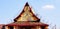 Construction workers repairing or fixing roof of ancient temple and clear blue sky background