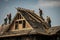 Construction workers repairing a roof