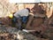 Construction workers repairing underground utility services pipe