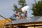 Construction Workers On Roof