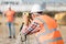 Construction workers setting equipment