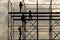 Construction workers silhouette working on iron platform sky background